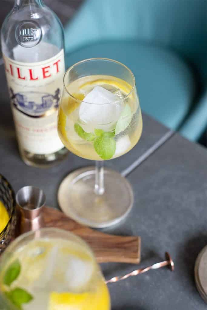 Cocktail with bottle of Lillet Blanc