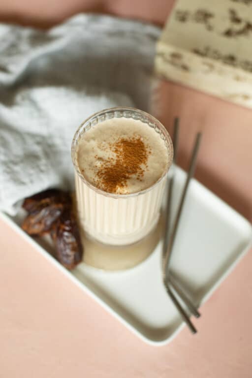 Date Shake on a plate with dates and straws