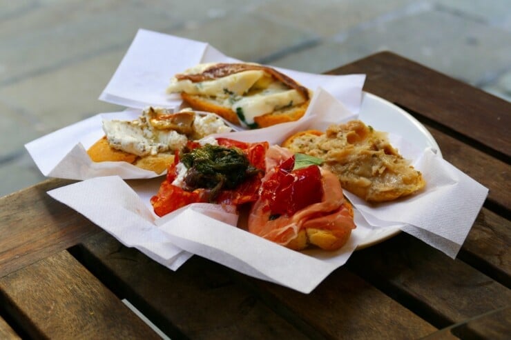 A plate of delicious cicchetti, tapas-like dishes indigenous to Venice, Italy. Sold in many cicchetti bars around town, often with casual street-side seating.