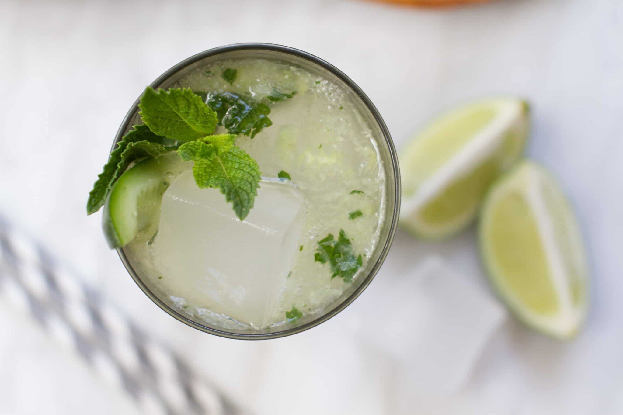 https://saltandwind.com/wp-content/uploads/2022/05/150206_cucumber-ginger-mojito-cocktail-recipe_h-1-scaled.jpg