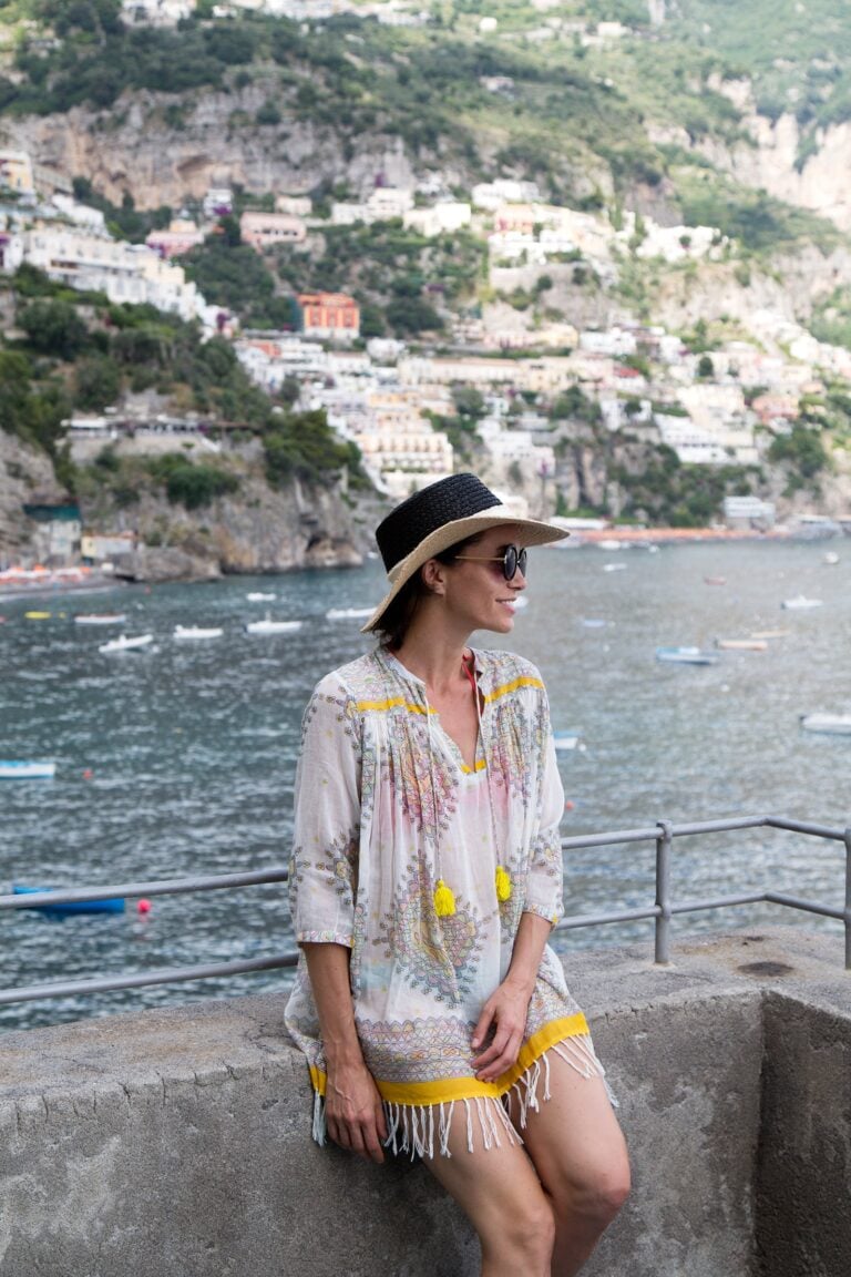 Woman at Torre di Clavel with view of Positano behind