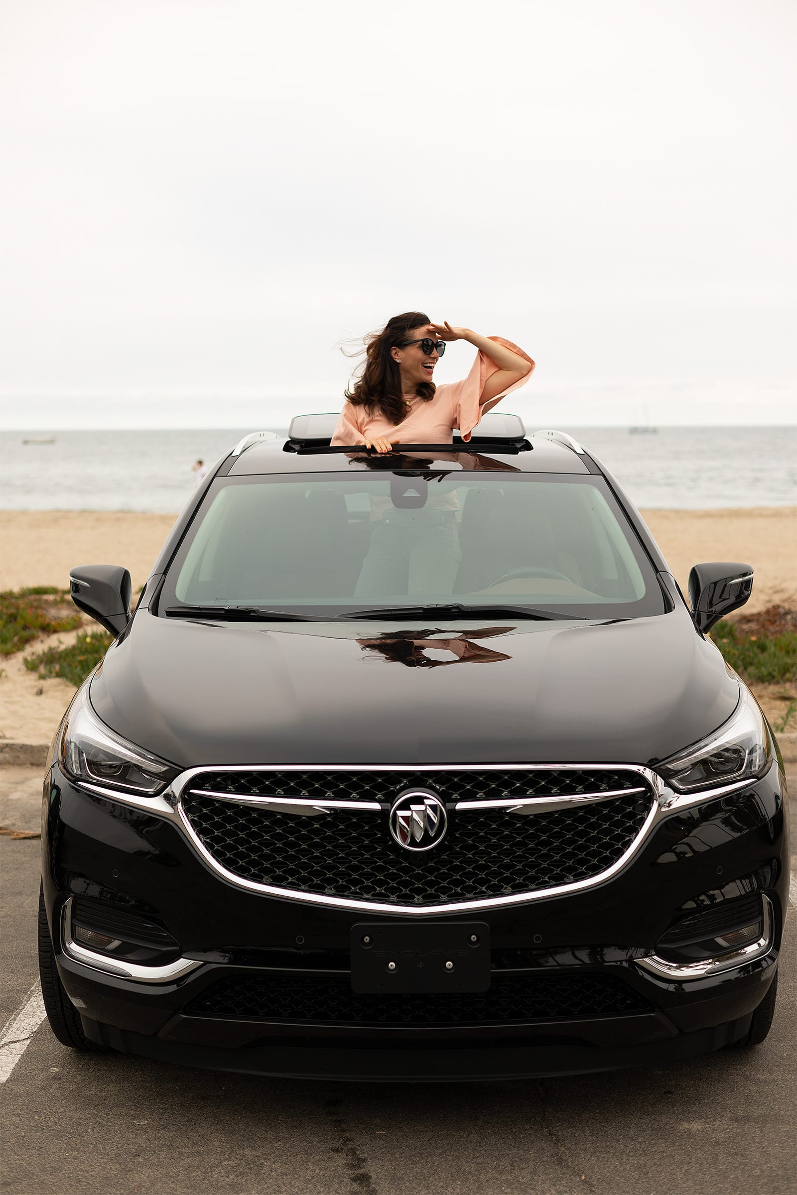 Girl Peeking Out Of Car Sunroof In Santa Barbara