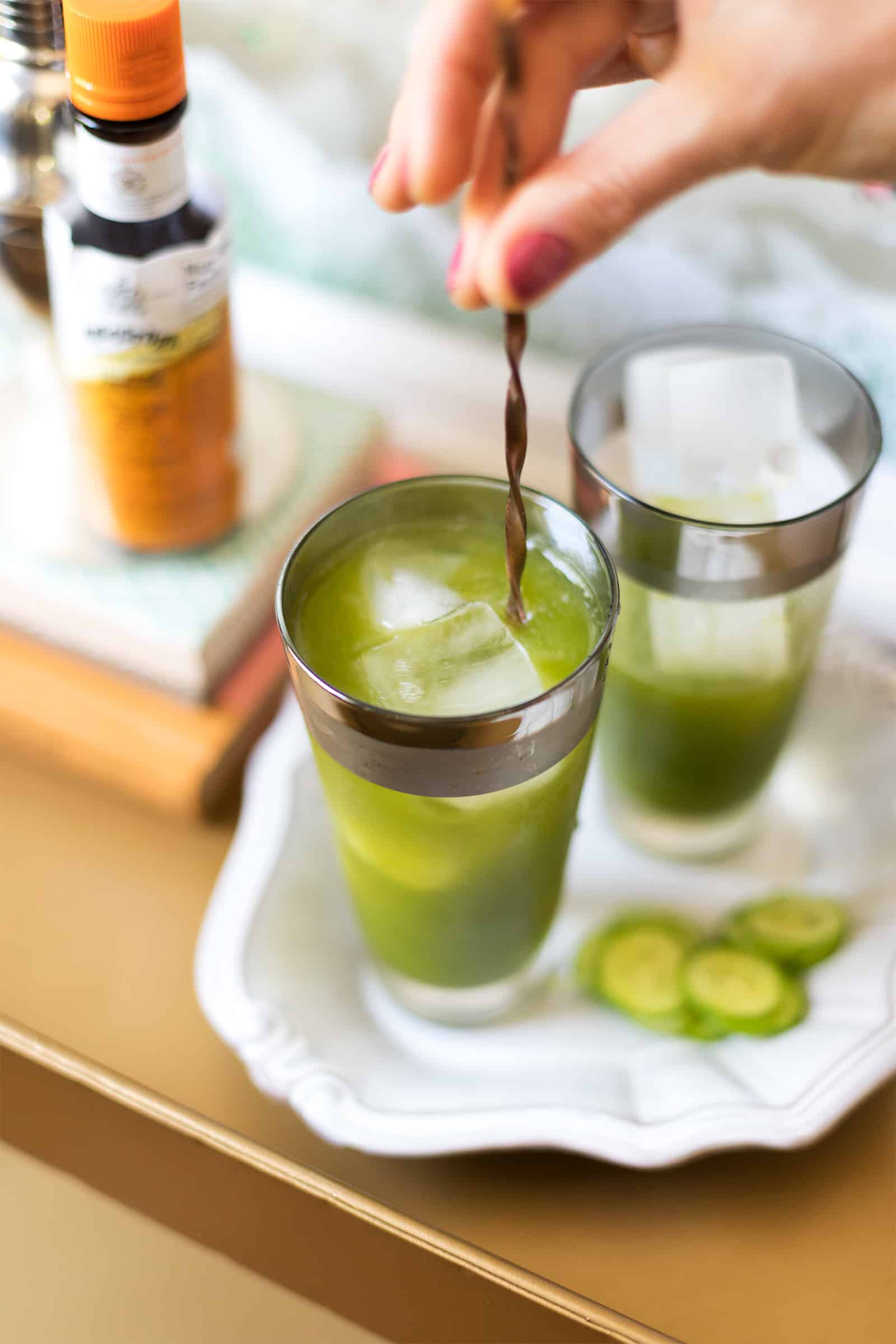 cucumber agua fresca cocktail stir