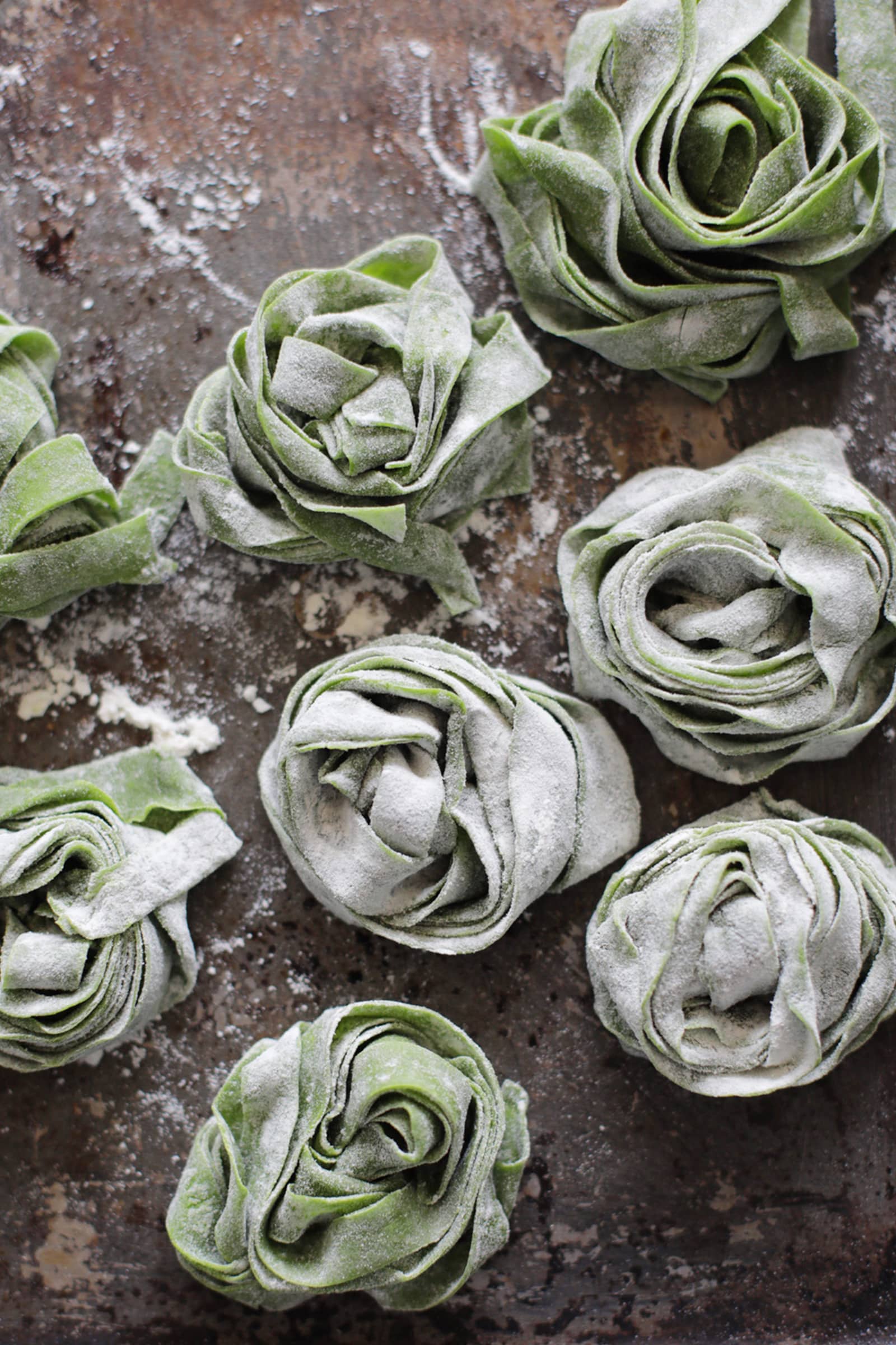 Homemade Spinach Tagliatelle Pasta Nests On A Tray