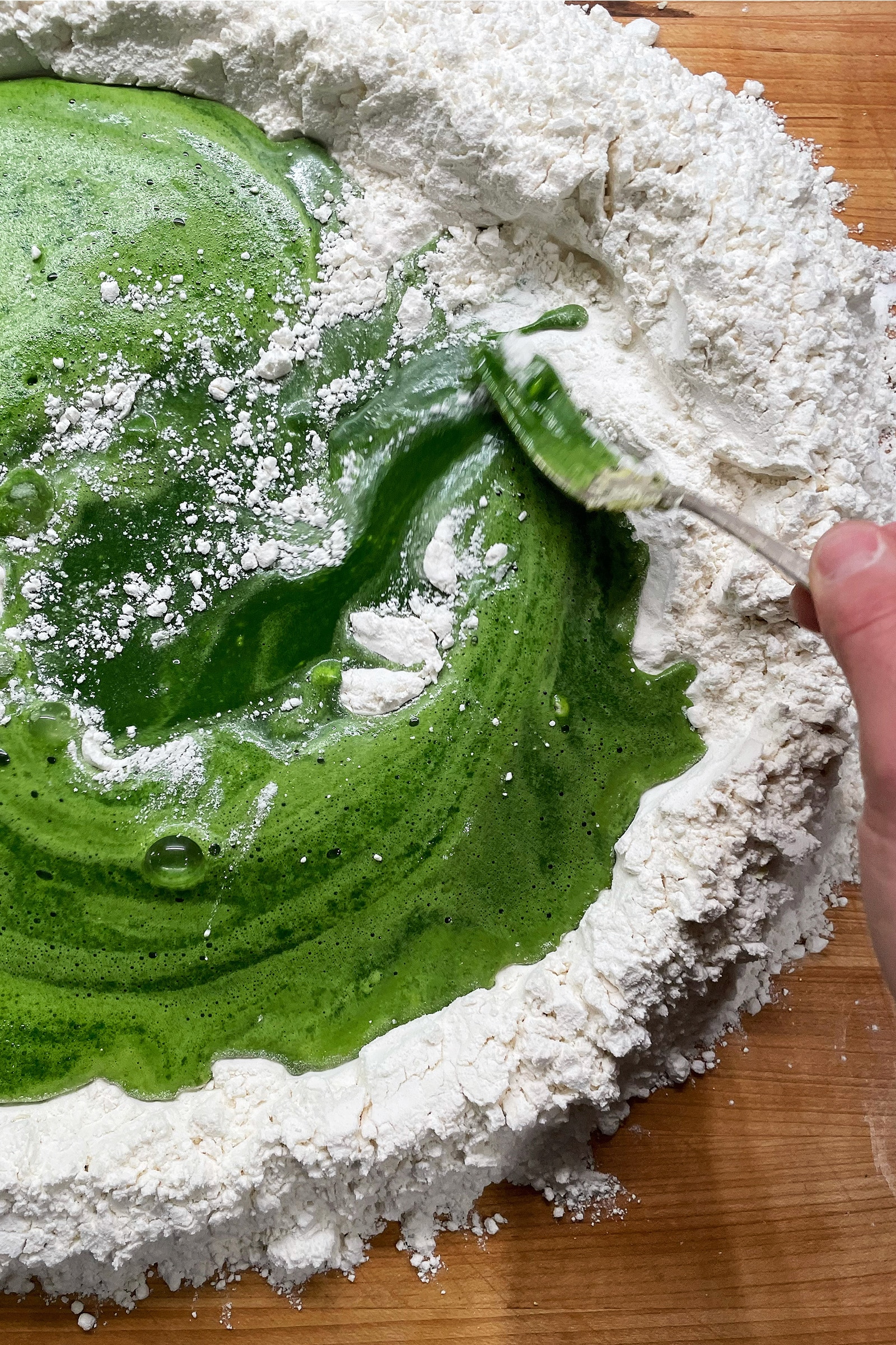 Spinach Puree Being Mixed Into Flour For Pasta
