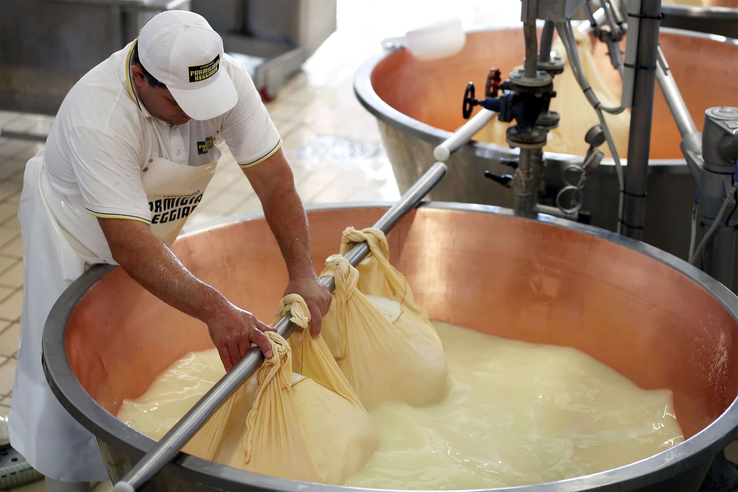 Man producing Parmigiano Reggiano cheese