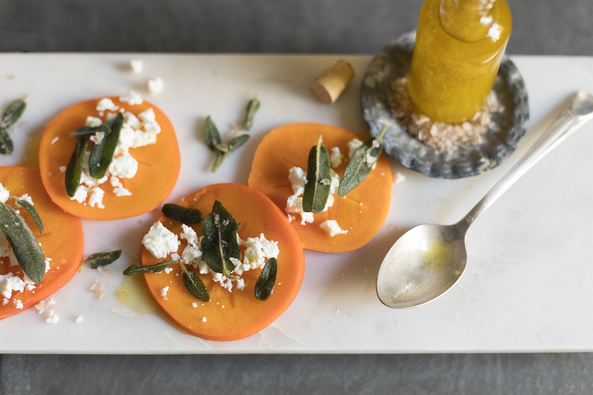 Persimmon, Fried Sage, and Goat Cheese Bites Recipe — Salt & Wind Travel