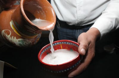 pulque drink being poured
