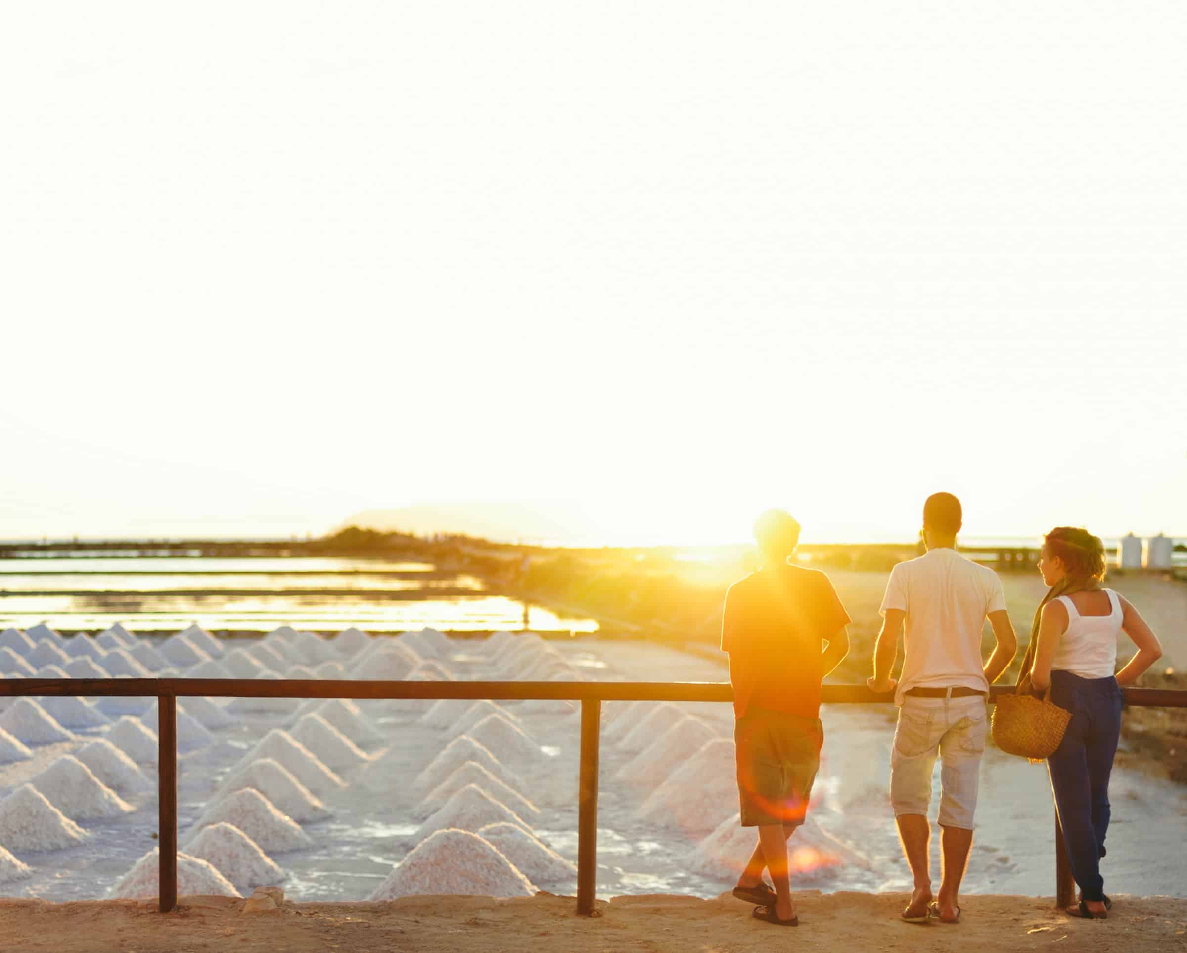 Friends Looking At A Salt Farm in Trapani Sicily