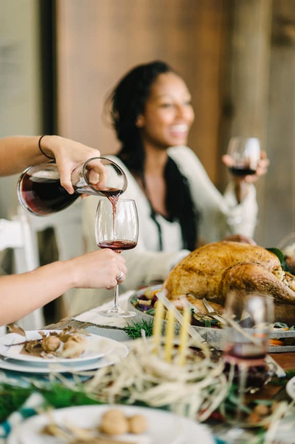 Wine Being Poured For Holiday Food And Wine Pairing Tips