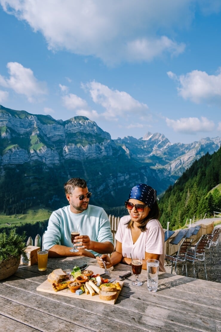 Couple dining alfresco in Swiss alps