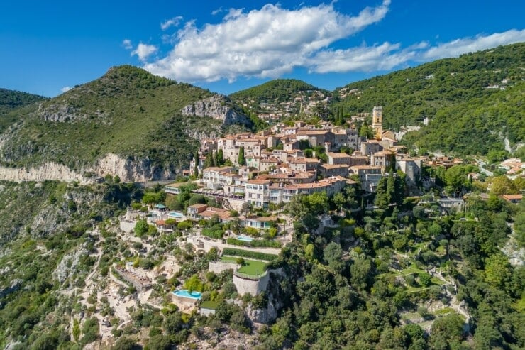 Aerial view of the medieval village of Eze on the Mediterranean coast, French Riviera, France. Historic town of Eze perched on a hilltop, surrounded by breathtaking landscapes and turquoise sea waters